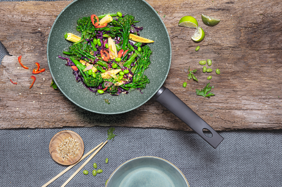 An eco-friendly frying pan with green vegetables