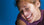 Happy woman smiling against blue background